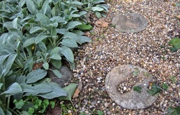 Stepping stones with the imprints of grandchildren's hands and feet.