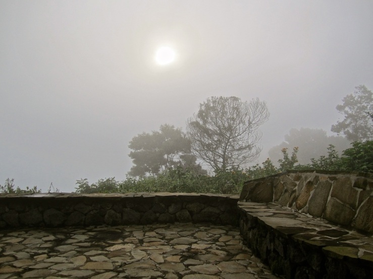 The stone terrace of our cabin in morning fog.